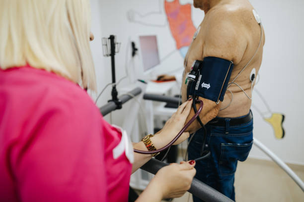 istock Preparing senior patient for heart stress test on treadmill 1305632674