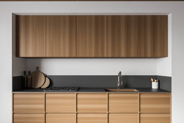 istock White and wooden kitchen interior with cupboards, close up 1305632779