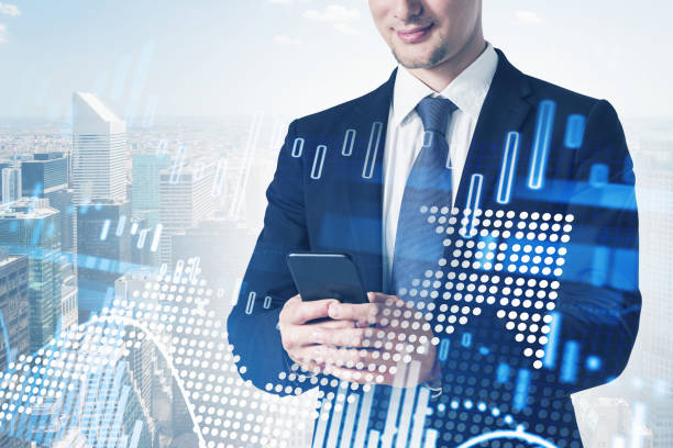istock Man in city and growing graphs 1305632922