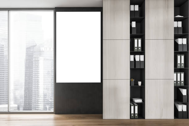 istock Mockup canvas in office room between window and office shelf with papers 1305634234
