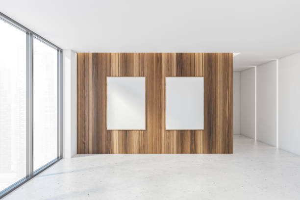 istock Two mockup frames in empty white and wooden office room with windows 1305634272