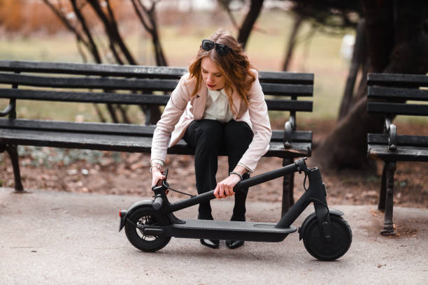 istock A young woman with electric scooter 1305636169