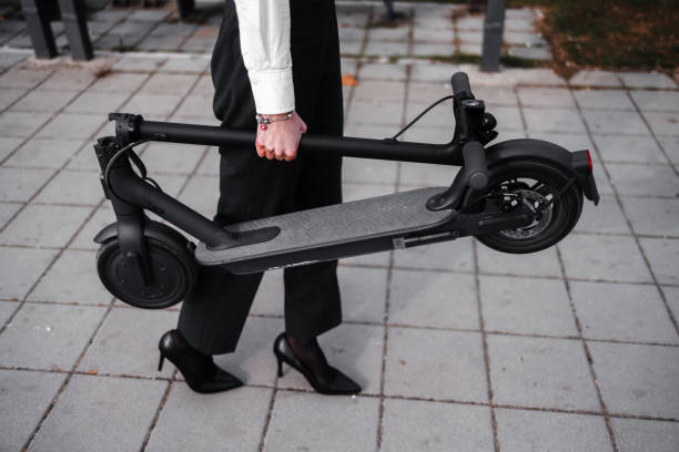 istock A young woman with electric scooter 1305636190
