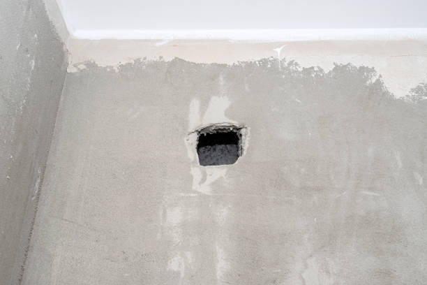istock Hole in the wall in the room from the gravity ventilation in the system chimney, raw state. 1305636734