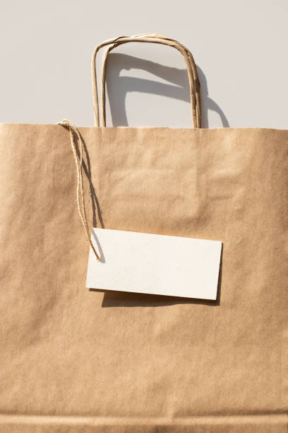 istock Paper reusable bag with blank white empty label card mock up. Delivery, shopping concept 1305637247