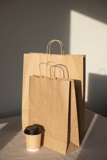 istock Paper reusable bags on a table. Delivery, shopping concept 1305637256