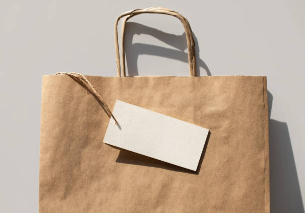 istock Paper reusable bag with blank white empty label card mock up. Delivery, shopping concept 1305637257