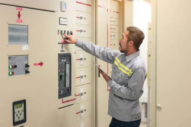 istock Close up hand of engineer or electrician man working check the electrical system with tablet at factory. 1305637511