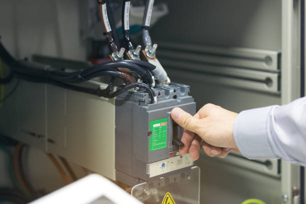 istock Engineering Hand Off The Power Circuit Breaker Is Installed In The Electrical Cabinet. 1305637539