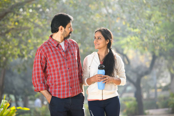 istock Couple discussing at park 1305638596