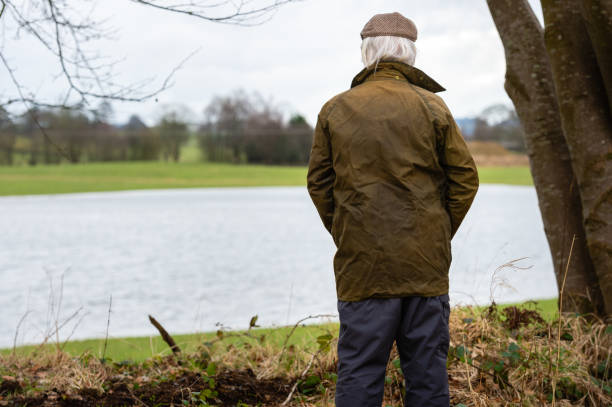 istock One man looking at flooding in a field 1305639969