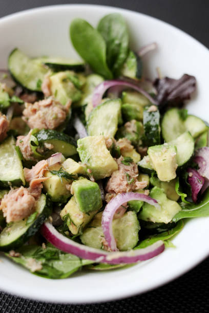 istock Vegetable salad with tuna and avocado 1305640809