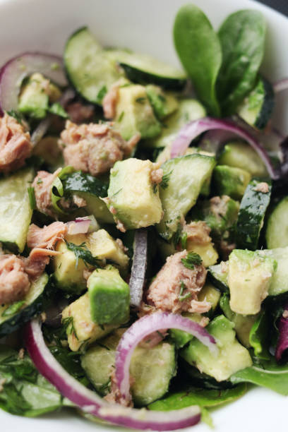 istock Vegetable salad with tuna and avocado 1305640829