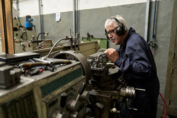 istock Senior Worker Operating Metal Casting Machinery 1305642468