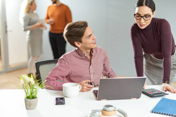 istock Two business people smiling because they get positive answer. 1305643472