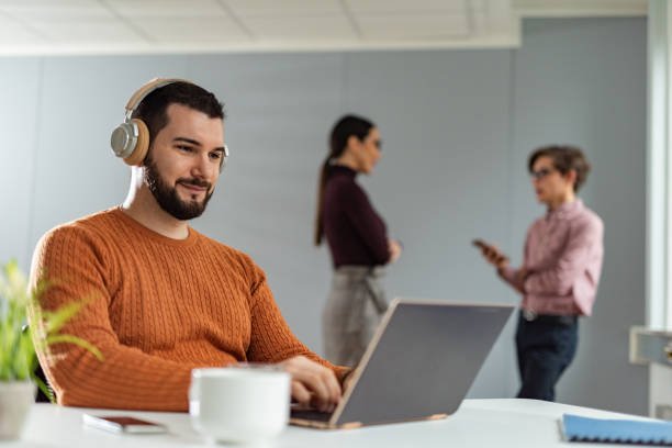 istock Focused young businessman holding video call with clients. 1305643514