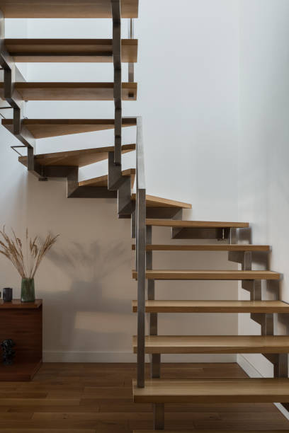 istock Modern wooden stairs with silver railing 1305645254