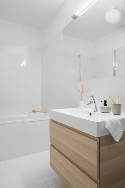 istock Bathroom washbasin with wooden cabinet 1305645289