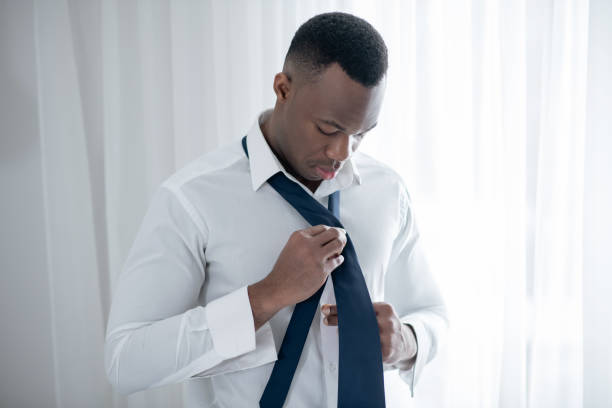 istock A young african american man wearing a tie and looking elegant 1305646209