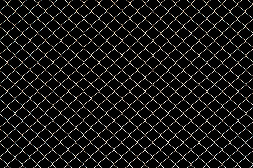 Wire mesh fence texture isolated on black background with clipping path