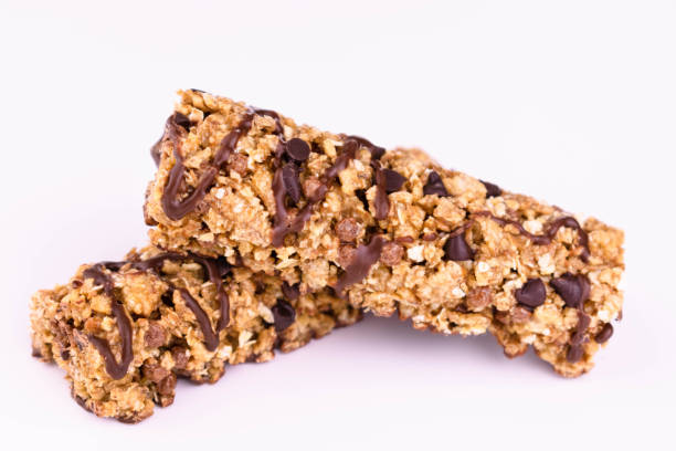 istock Two granola bars on a white background. Close-up. 1305650282