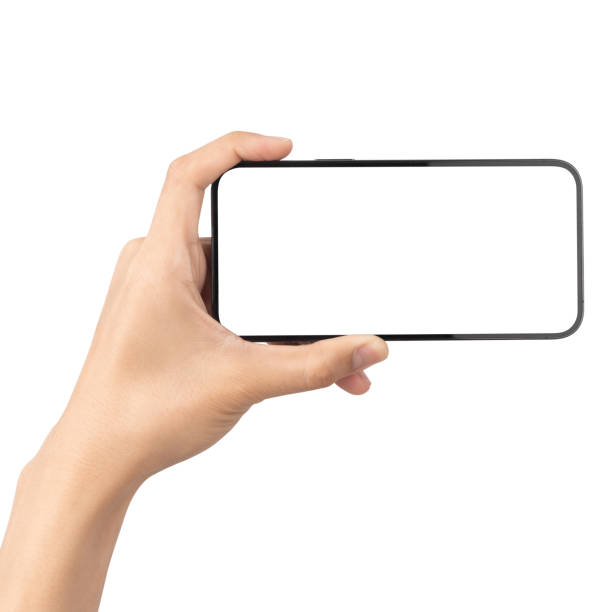 istock Man hand holding the black smartphone with blank screen isolated on white background with clipping path, Can use mock-up for your application or website design project 1305652715