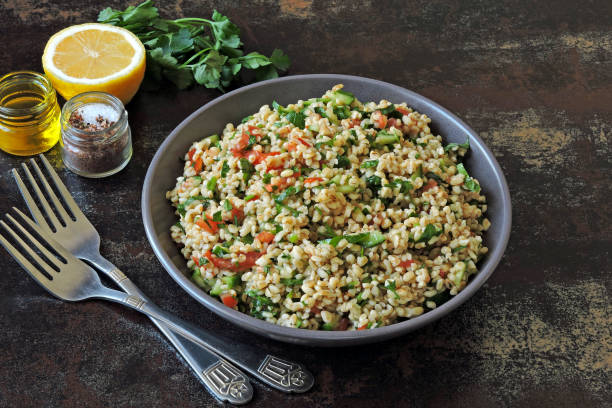 istock Salad with bulgur, vegetables and parsley. 1305654244