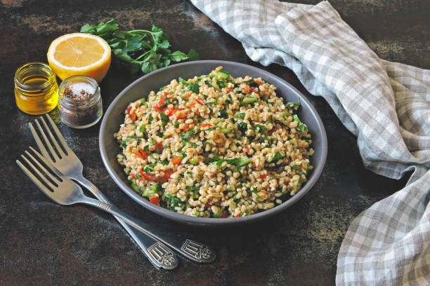 istock Salad with bulgur, vegetables and parsley. 1305654263