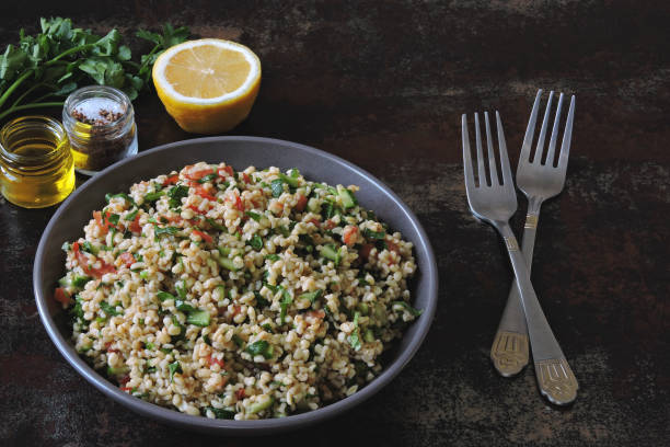 istock Salad with bulgur, vegetables and parsley. 1305654288