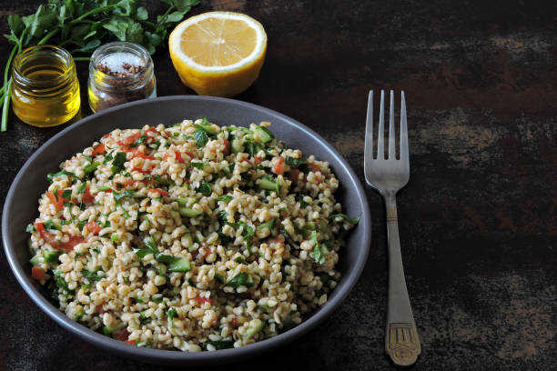 istock Middle Eastern salad with bulgur and vegetables. 1305654289