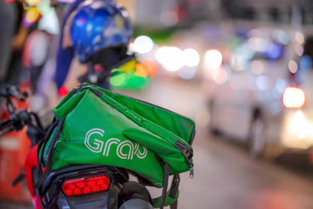 Grab bike Bangkok, Thailand-January 2 : Grab bike on Yaowarat road on January 2,2021,Bangkok, Thailand. reach destination stock pictures, royalty-free photos & images