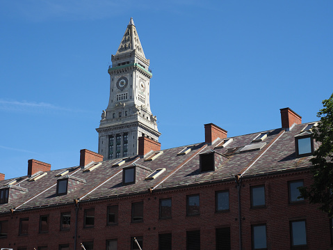 Boston, USA - June 15, 2019: Image of the Custom House Tower towering over its surrounding buildings.