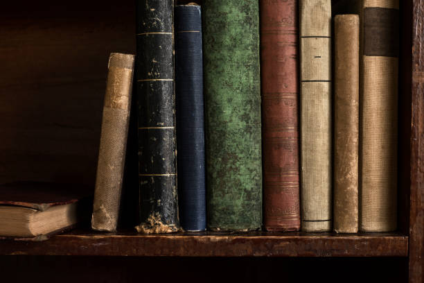 istock Antique Books Lined Across a Shelf 1305663793