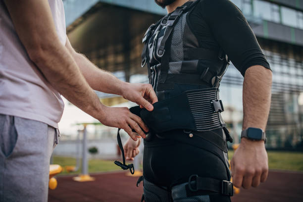 istock Getting dressed in electrical muscular stimulation suit outdoors 1305664575