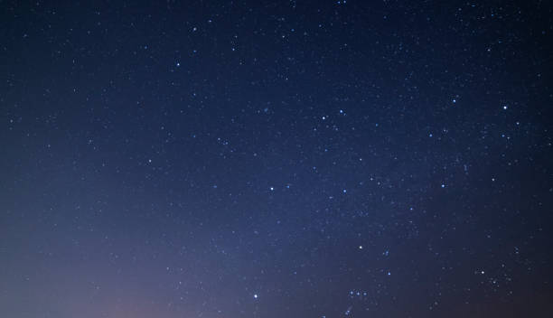 istock Beautiful blue starry sky. Night photography, astronomical background. 1305665064