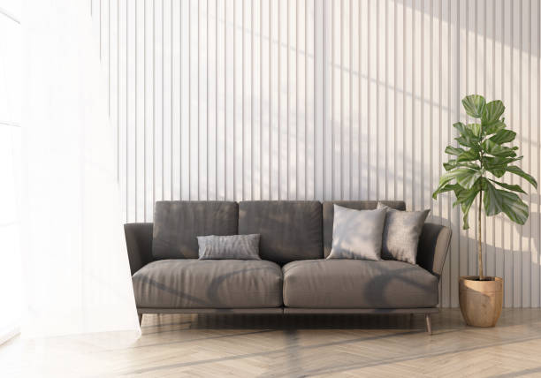 istock grey sofa on wooden floor Light shines through the window and shadows fall on it. with white wall and sheer 3d rendering 1305666251