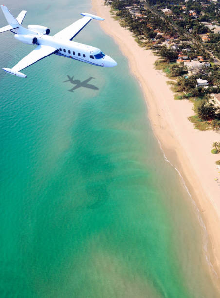 Airplane flying to Miami. Airplane flying to Miami, Florida, USA. florida beach above stock pictures, royalty-free photos & images