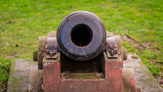 Looking down the barrel of a cannon on the Moat Brae at Kirkcudbright