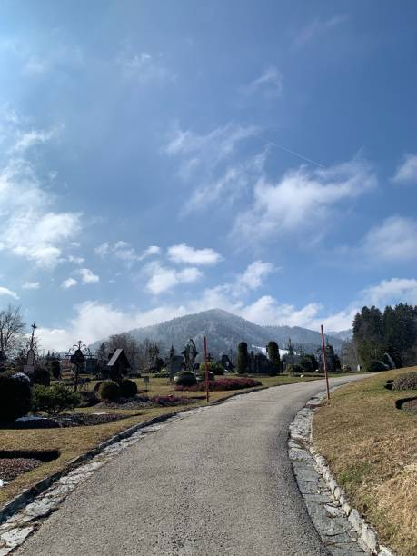 istock Path between graves, with a view of the mountains 1305669859
