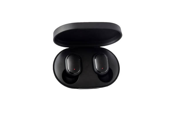 istock Wireless headphones on a white background. Close-up. Bluetooth headset in charging case. 1305670083