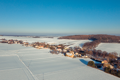 Aerial view of snow-covered fields, agricultural area near Stolec a village in Lower Silesian Voivodeship, in south-western Poland.
