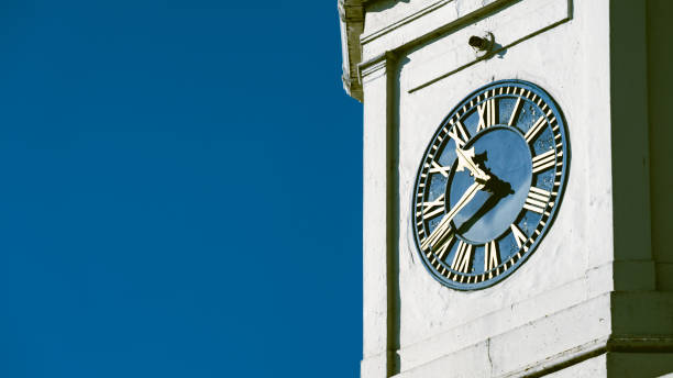 istock An old clock tower against a blue sky with copy space 1305672084