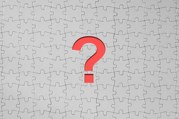 istock Uncertainty Concept - Jigsaw Puzzle Pieces Forming A Cut Out Red Question Mark 1305672094