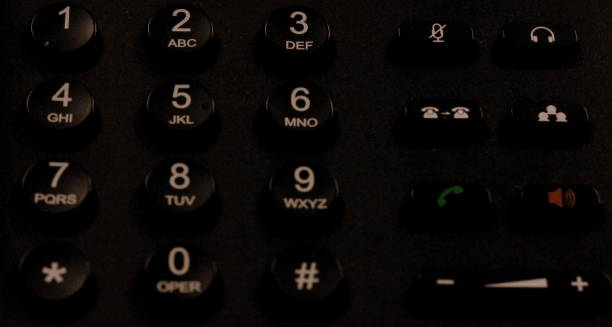 istock Telephone keypad concept for communication, contact us and customer service support.TNT landline .Black Background. 1305672170
