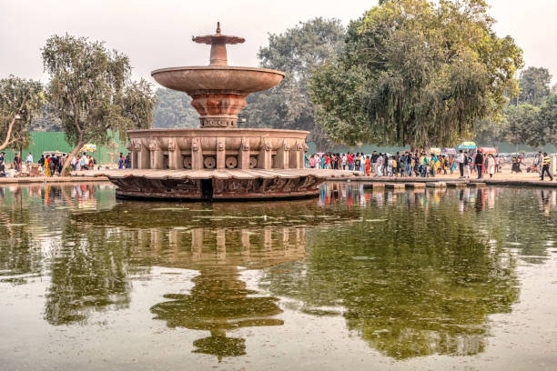 Delhi, India - Nov 9, 2018: Tourists visiting fountain at Humayun Tomb complex UNESCO world heritage site built in 16th century and located in Nizamuddin East, Delhi, India.