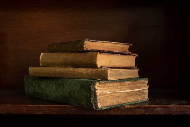 istock Antique Books Stacked on a Shelf 1305676077
