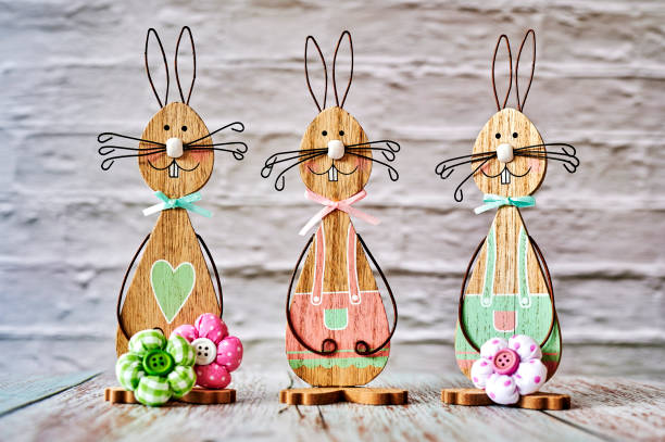 istock Wooden Easter bunnies with decoration. 1305679124