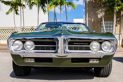 Miami, Florida USA - March 5, 2017: Close up front view of a beautifully restored 1967 Pontiac Firebird convertible at a public car show.