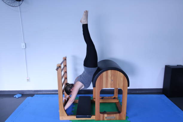 istock woman doing pilates physical exercises 1305680371