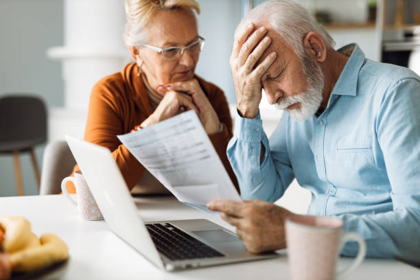 istock Senior couple  having problems with paying their bills 1305683039